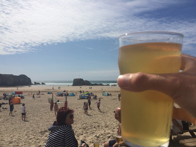 A pint of Rattler in the sunshine at the Watering Hole, Perranporth, Cornwall