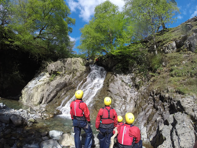 Watching on as the group descends the waterfall at Church Beck